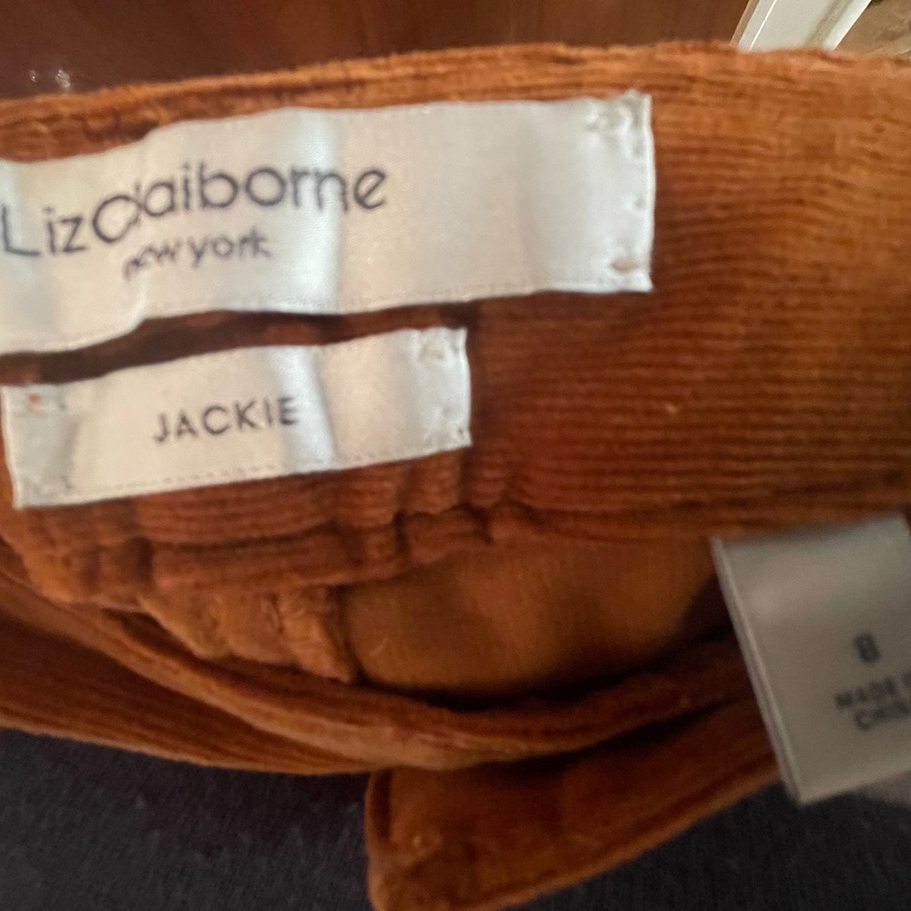 One long female corduroy pant.